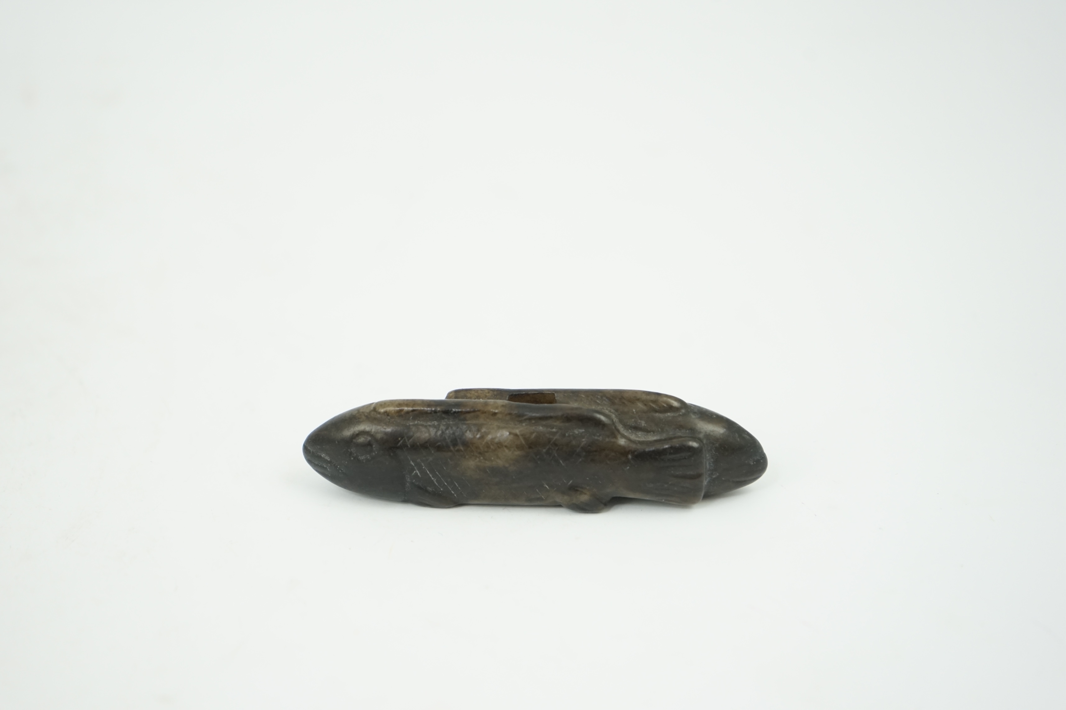 A Chinese black and white jade 'fish' sword fitting, Song or later